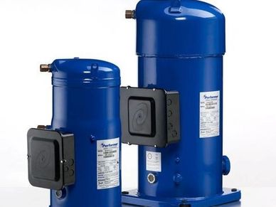 Two blue industrial compressors of different sizes.