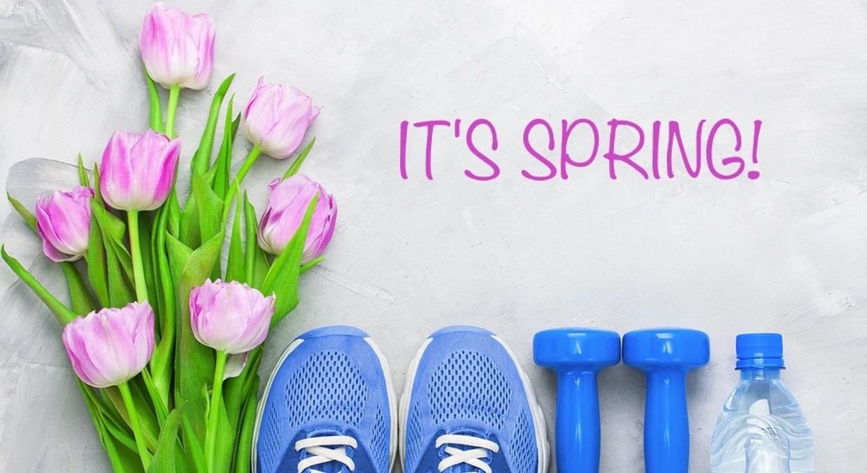 Spring fitness essentials with pink tulips and blue workout gear.