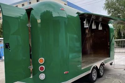 View of green Mailbox Style Trailers