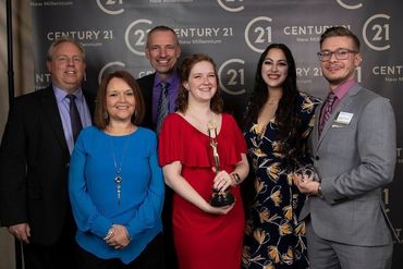 Award-Winning Success: Bill DePugh Stands Proudly w/ the Century 21 Team, Recognized for Excellence