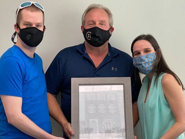 Joyful Home Purchase Completion: Bill DePugh Celebrates with Happy Clients at Closing