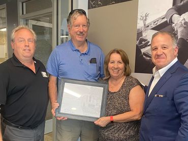 Successful Home Purchase Celebration: Bill DePugh and Alex Navarro, along with Satisfied Clients