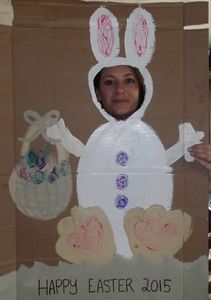 Bunny with Easter basket painted on cardboard with face cut out, and a girl's face looking through!