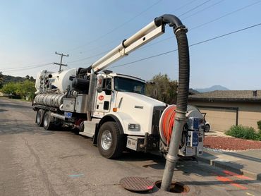 Sewer cleaning with sewer truck.