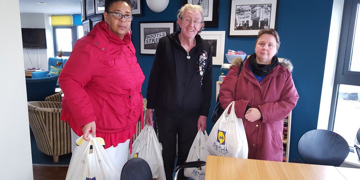 Widower receiving food items from our food bank