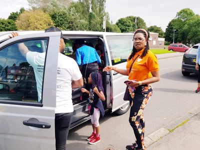 Widows and Widowers getting into a car for their fun day out with a bereavement charity.