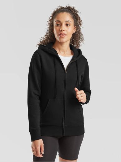 Woman wearing a black zip-up hoodie and black shorts.