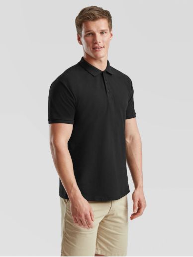 Man wearing a black polo shirt and beige shorts.