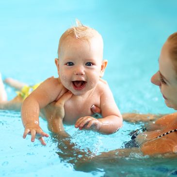 Baby and parent swimming