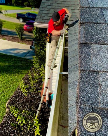 OnPoint Property Inspector performing a gutter and roof inspection