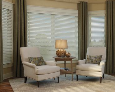 Custom painted wood window blinds installed on a residential window with a clean modern look