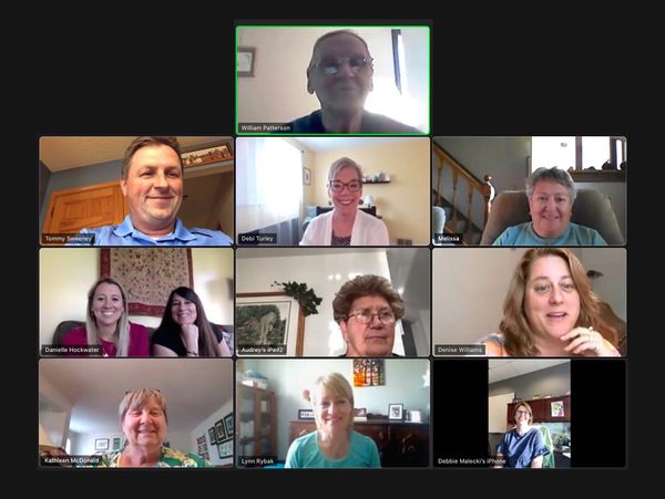 Depew Community Center leadership team smiling during a video conference call.