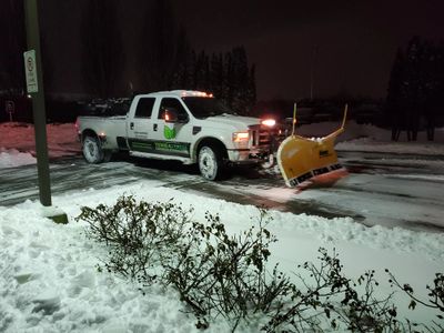 Commercial snow removal truck servicing a Richmond BC office property with snow plowing and winter m