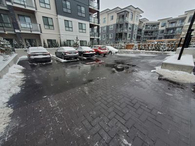 Fully cleared parking lot in Richmond BC of snow and ice. Applied salt and ice-melt at commercial pr