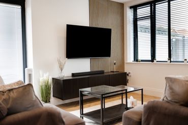 wood slated acoustic panels tv wall hung tv unit ikea sofas modern rung bifold doors airbnb