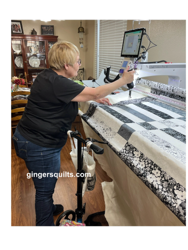 Client with long arm quilting machine