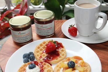 a plate of pancakes and a cup of coffee