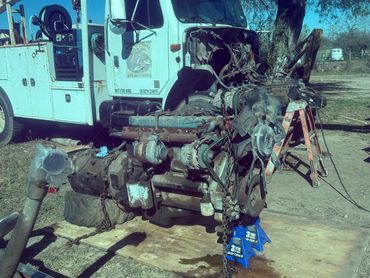 Engine pull on service truck for rebuild.