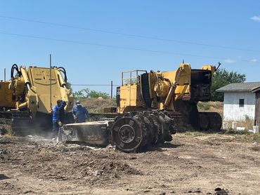 Removing boom's out of a 1255/1155 trenchers for transport.