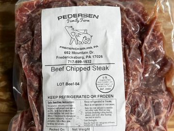 Package of Pedersen Family Farm beef chipped steak with label details.