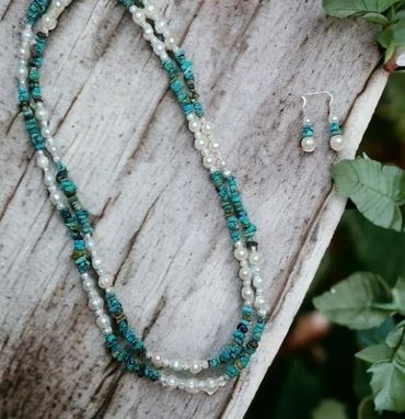Turquoise and pearl jewelry set with necklace and earrings.
