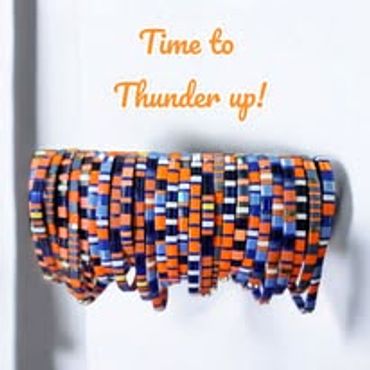 Colorful wristbands with 'Time to Thunder up!' text above them.