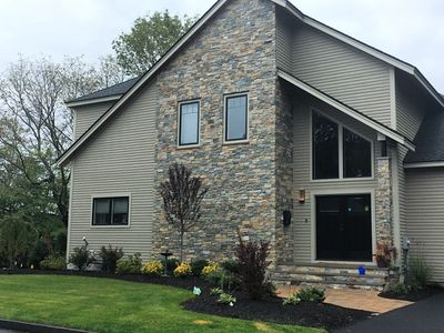 Shrubs and bushes create a stunning new entrance to any home.