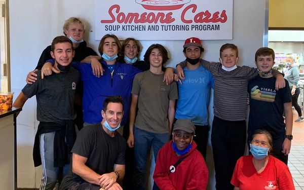 Group of smiling volunteers posed together.