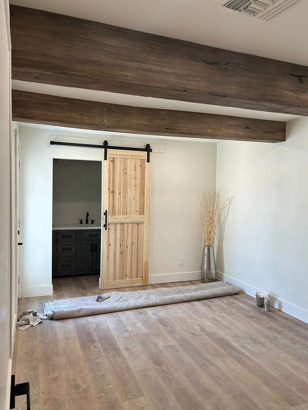 Fake wood ceiling beam covers or sleeves made to cover existing beams