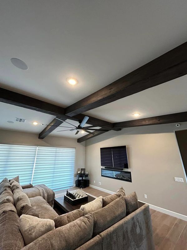Fake wood ceiling beam covers or sleeves made to cover existing beams