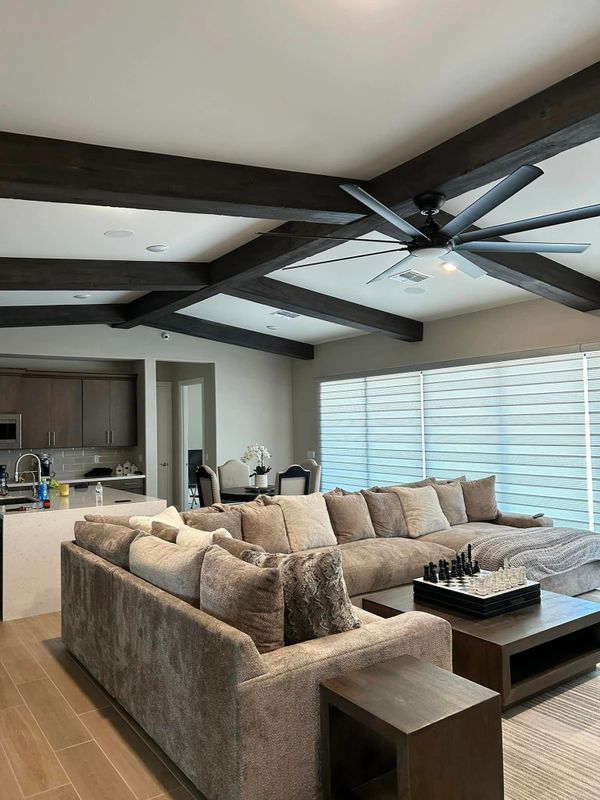 Fake wood ceiling beam covers or sleeves made to cover existing beams