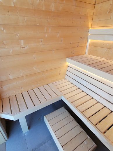 Custom built sauna with track lighting.