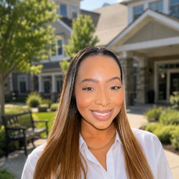 Smiling woman with long hair outdoors on a sunny day.