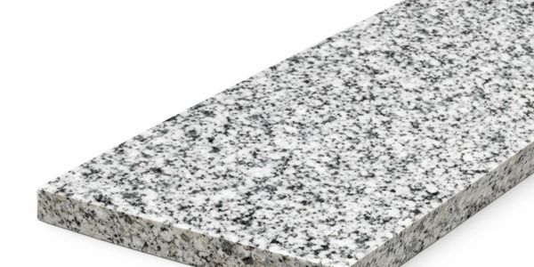 Polished gray and white granite slab with black speckles.