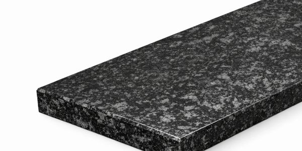 Polished black granite slab with white speckled pattern.