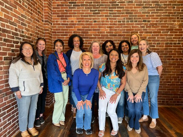 A group of women smiling for the camera