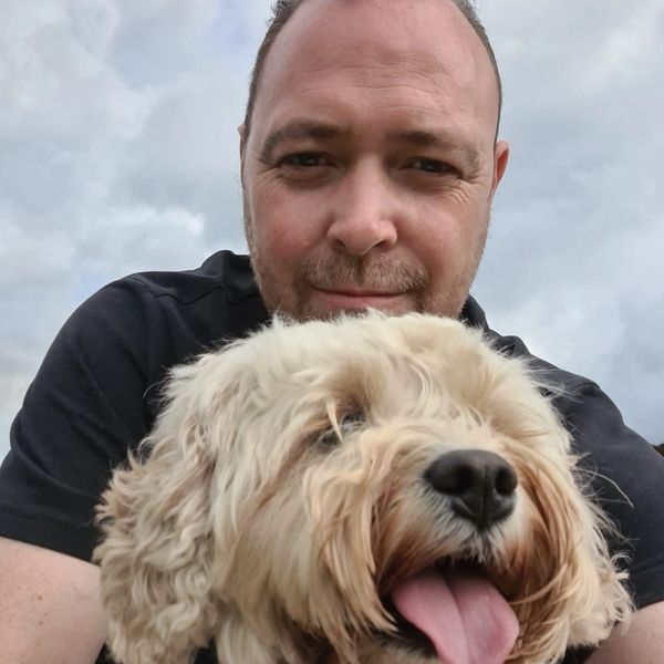 Alex Brown and a cavapoo
