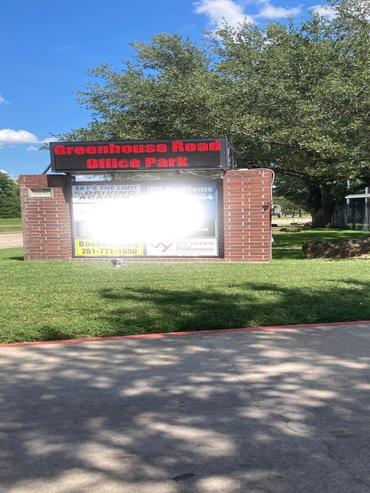 front of the business at Greenhouse RD, close to Clay rd