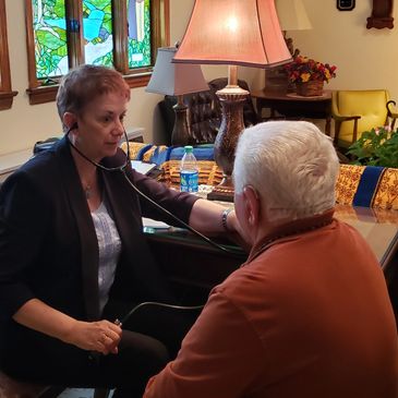 Parish Nursing at the Wallington Presbyterian Church. Marion Spranger checks blood pressure.