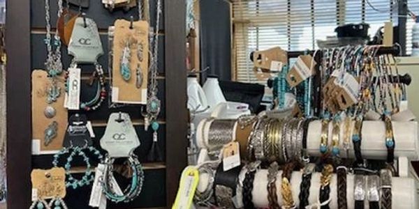 Display of assorted bracelets and necklaces in a store.