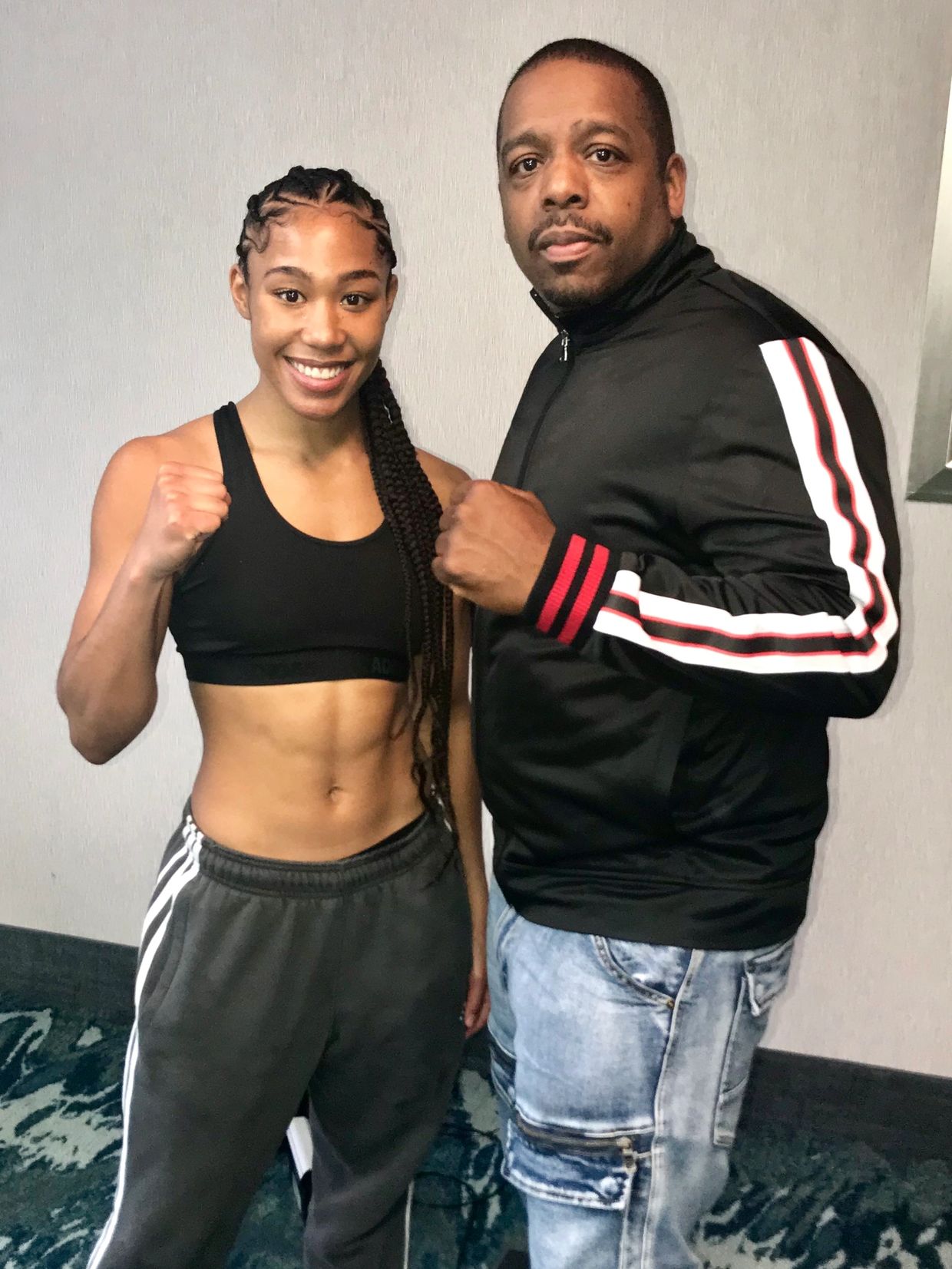 Champion Alycia Baumgardner and Rodney Ash. Rodney Ash is the founder of Hot Rod Sports.