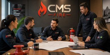 Team meeting at CMS Fire company discussing plans and strategies.