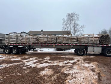 Loaded semi of Birch Poles