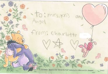 Handwritten Winnie the Pooh card with characters and floral decorations.