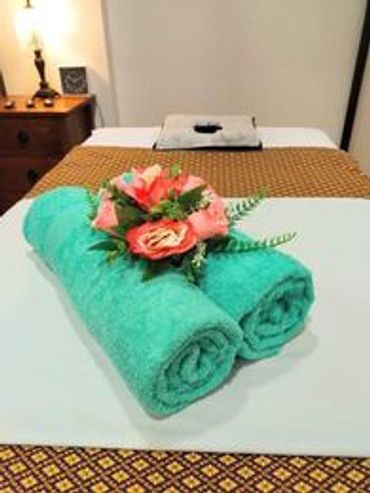 towels and flowers in the massage room