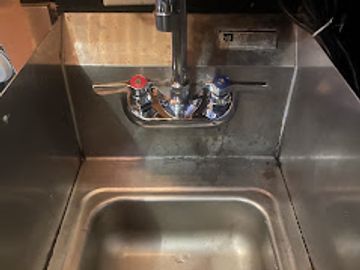 Installing a bar faucet in a local pub.