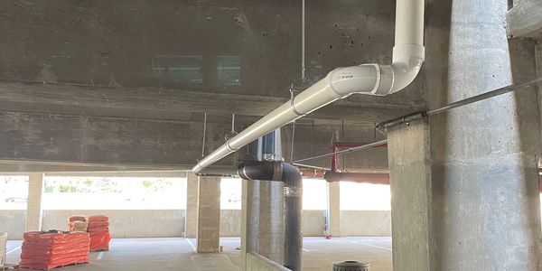 Storm water drain line install for a parking garage.