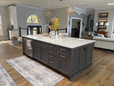 Kitchen Island with beautiful dark grey accent color.