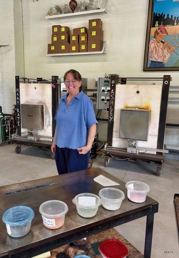 Me in front of the glass melting kilns