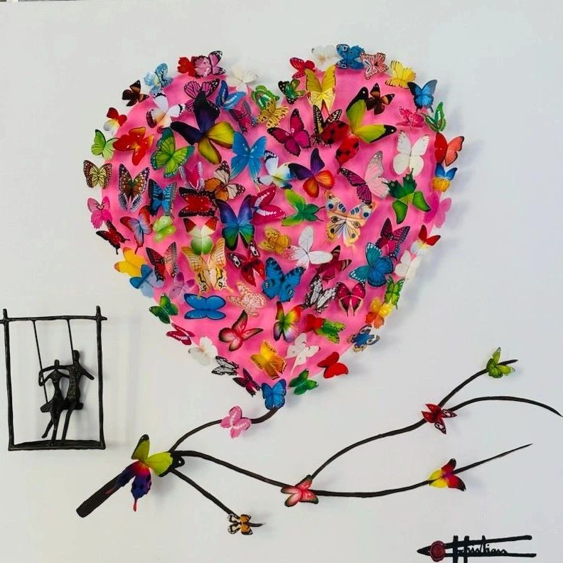 Heart with more than 100 butterflies and a sculpture